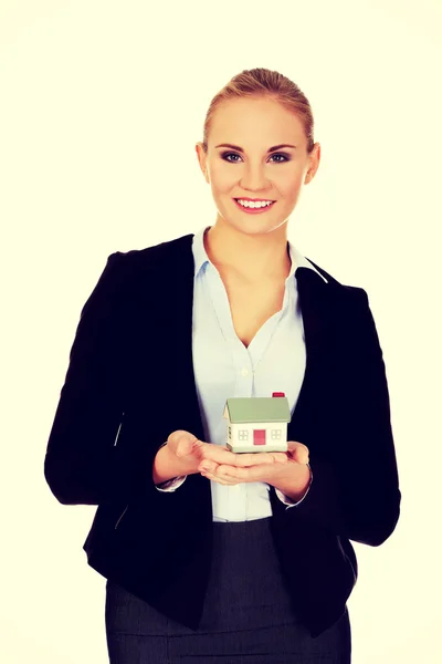 Business woman holding a house model — Stock Photo, Image