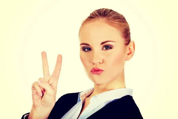 Happy business woman showing victory sign. — Stock Photo, Image