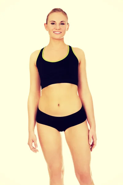 Athletic young woman in sports underwear — Stock Photo, Image