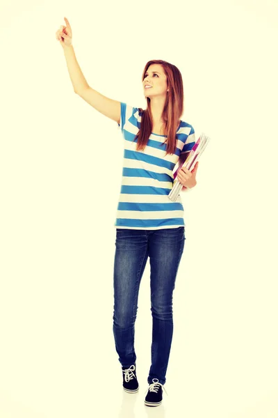 Teenage woman showing copyspace or something — Stock Photo, Image