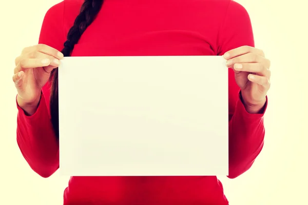 Young woman holding blank white banner — Stock Photo, Image