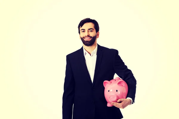 돼지 은행을 쥐고 있는 사업가. — 스톡 사진