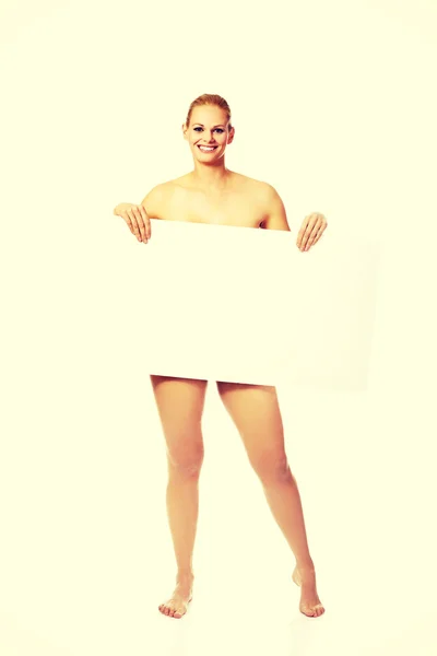 Sexy nahá blondýna drží prázdná deska — Stock fotografie