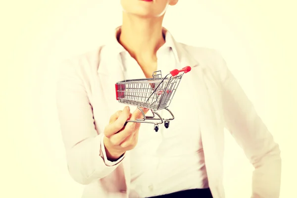 Attractive business woman holding small trolley — Stock Photo, Image