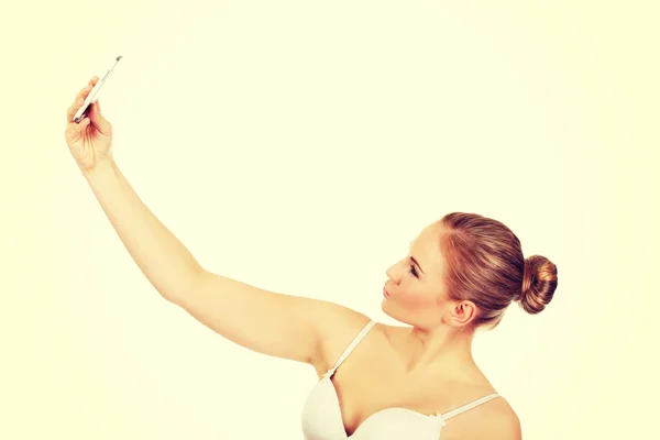 Young woman in underwear makes photo of herself — Stock Photo, Image