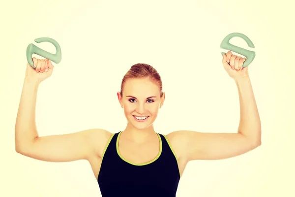 Young fitness woman exercising with weights — Stock Photo, Image