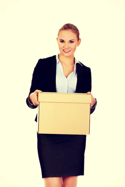 Business woman holding cardboard box — Stock Photo, Image