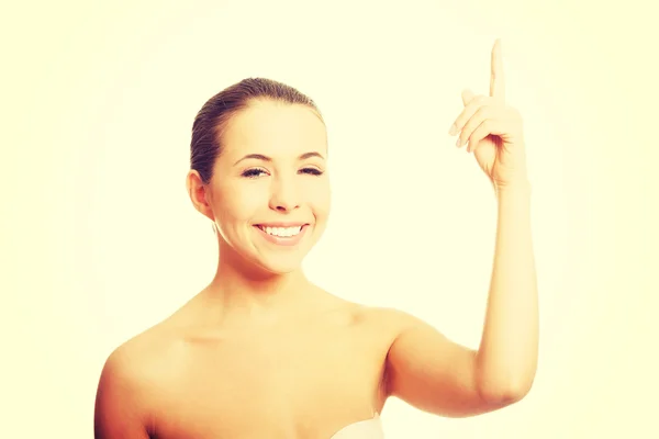 Nude woman pointing up — Stock Photo, Image