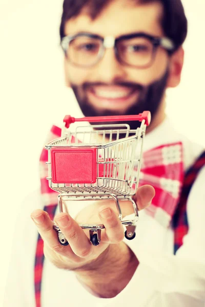 Man wearing suspenders with small shopping basket. — Stock Photo, Image