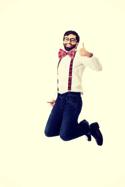 Old fashioned man wearing suspenders jumping. — Stock Photo, Image