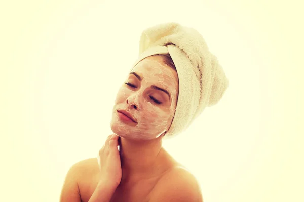 Portrait of woman with closed eyes and face cream — Stock Photo, Image