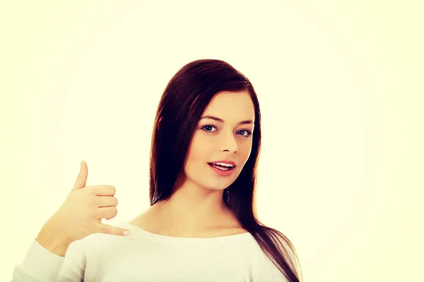 Young woman making a call me gesture — Stock Photo, Image