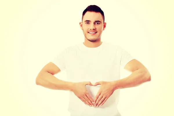 Young man doing heart gesture — Stock Photo, Image