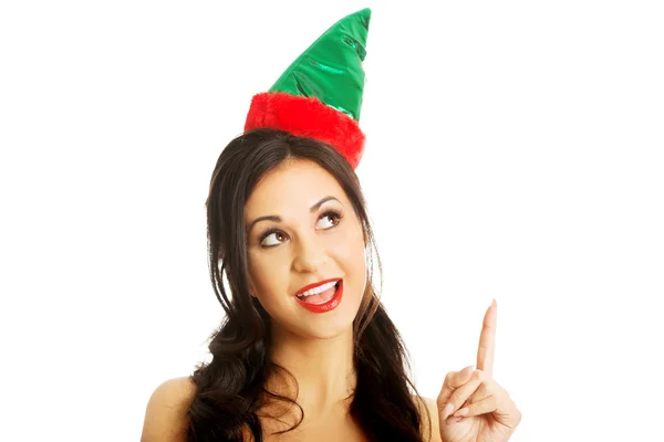 Portrait of woman wearing elf clothes pointing up — Stock Photo, Image