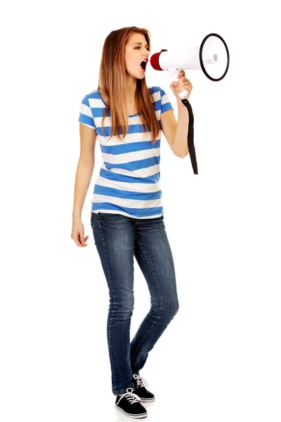 Teenage woman screaming through megaphone — Stock Photo, Image