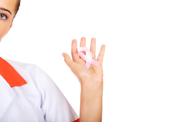 Female doctor holding pink breast cancer awareness ribbon — Stock Photo, Image