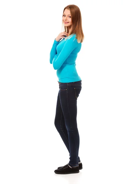 Young woman standing with toothy smile — Stock Photo, Image