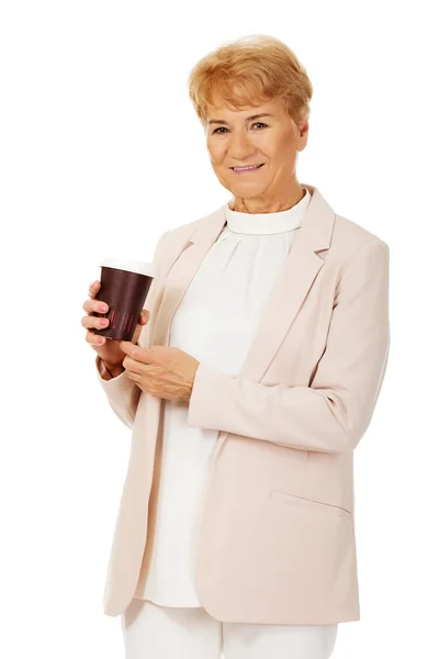 Smile elderly elegant woman holding paper cup — Stock Photo, Image