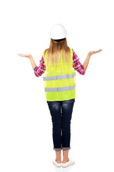Back view of female builder making do not know sign — Stock Photo, Image