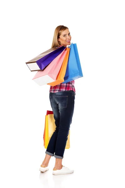 Young smiling woman holding shopping bags — Stock Photo, Image