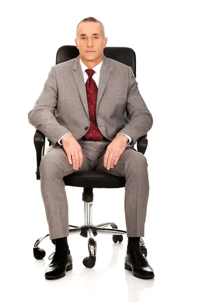 Επιχειρηματία που κάθεται στην πολυθρόνα — Φωτογραφία Αρχείου