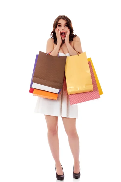 Mujer sorprendida con bolsas de compras —  Fotos de Stock