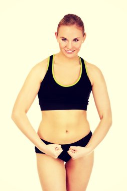 Kasların esneme genç atletik kadın