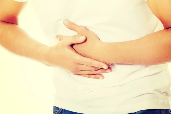 Joven con dolor de estómago fuerte — Foto de Stock