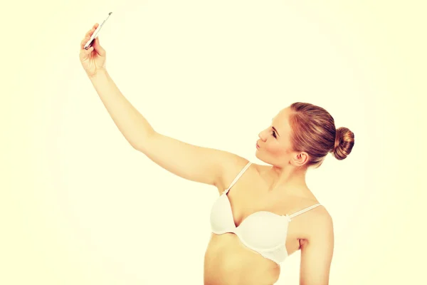 Young woman in underwear makes photo of herself — Stock Photo, Image