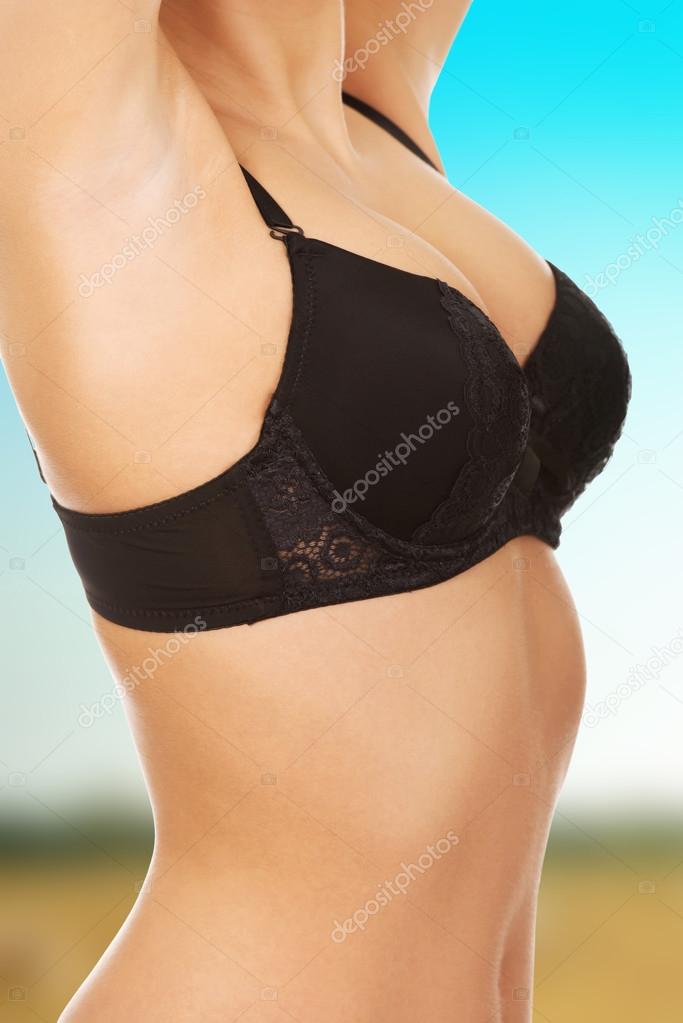 Woman's breast in pink bra. Stock Photo