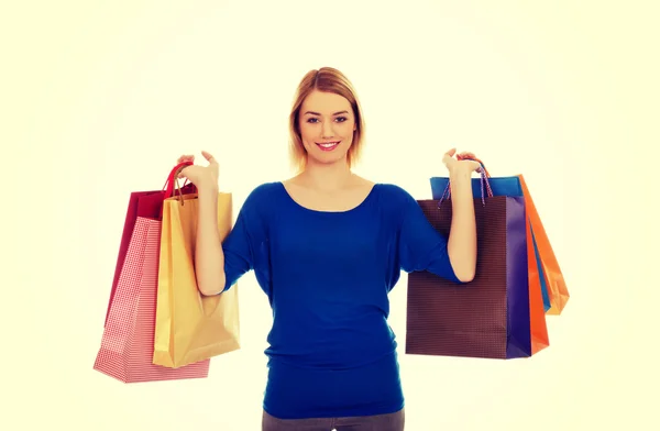 Vrouw met veel boodschappentassen. — Stockfoto