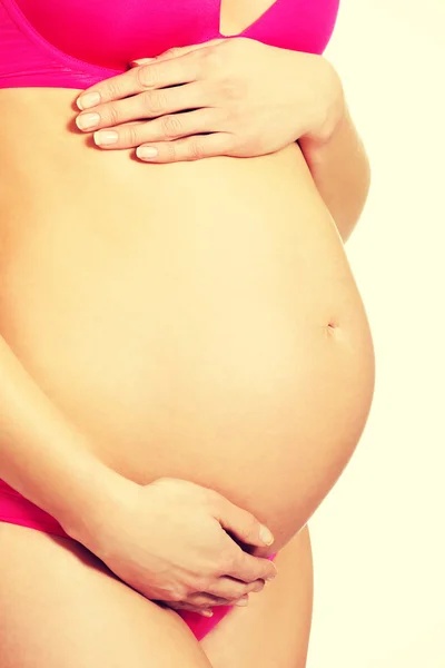 Mujer embarazada tocando el vientre —  Fotos de Stock