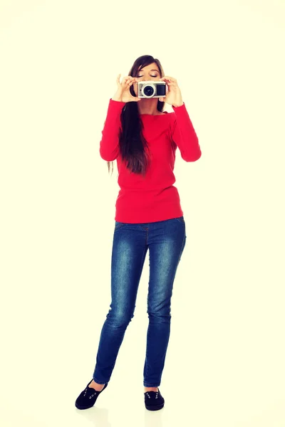 Woman taking a photo with a camera. — Stock Photo, Image