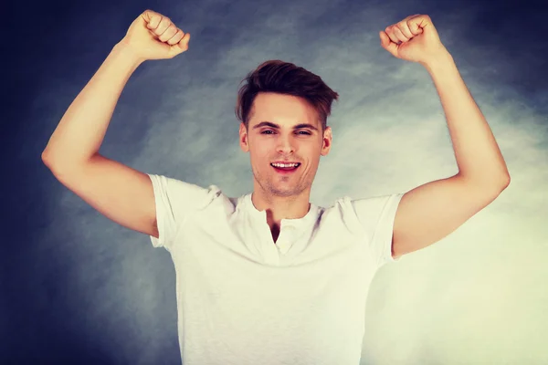 Young man showing winner gesture. — Stock Photo, Image