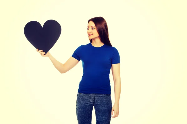 Happy teenager holding paper heart. — Stock Photo, Image