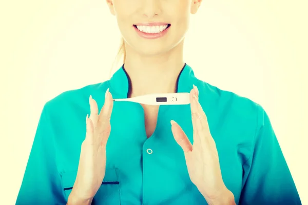 Attractive doctor with a thermometer. — Stock Photo, Image