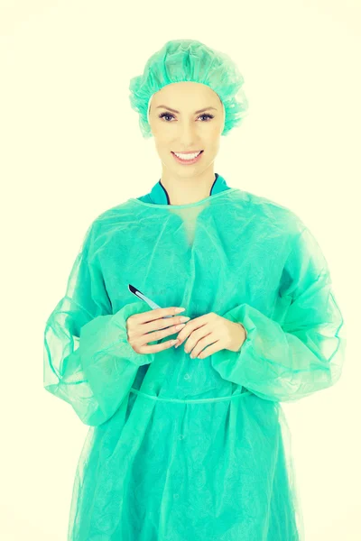 Female doctor with a scalpel. — Stock Photo, Image