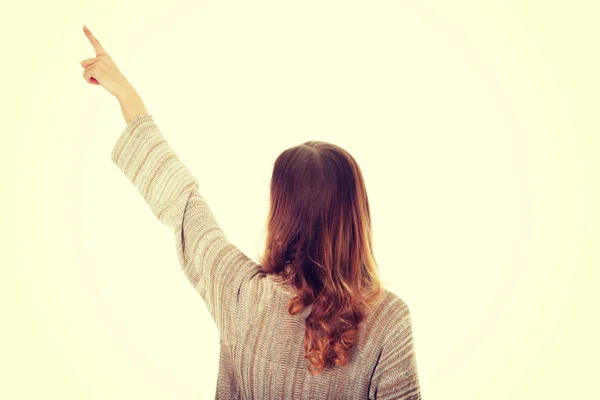 Beautiful woman pointing up. — Stock Photo, Image