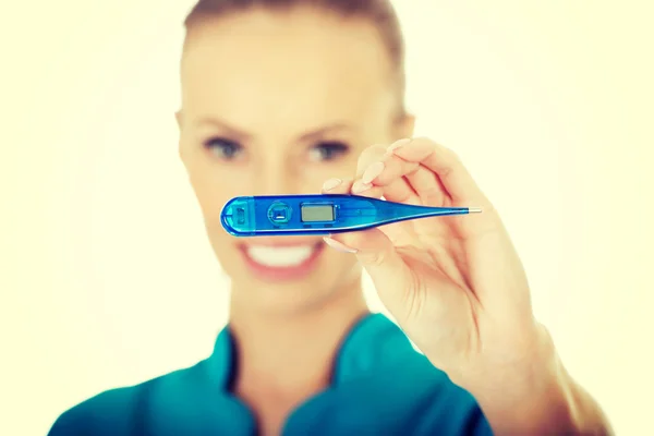 Attractive doctor with a thermometer. — Stock Photo, Image