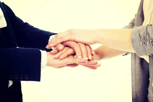 Two businesswomen holding their hands together. — Stock Photo, Image