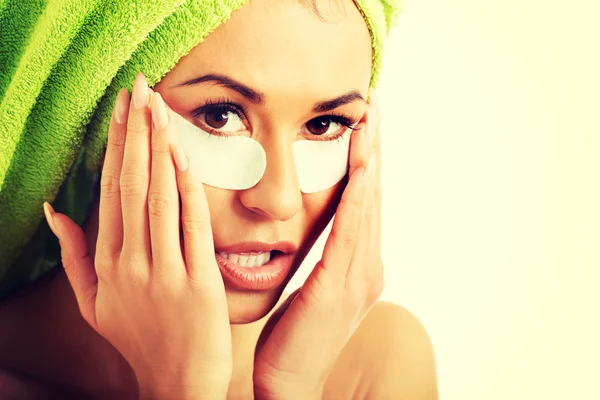 Woman with gel eye mask — Stock Photo, Image