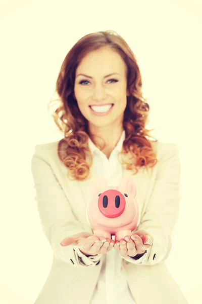 Business woman with a piggybank. — Stock Photo, Image