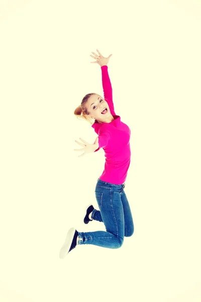 Young caucassian woman is jumping. — Stock Photo, Image