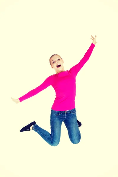 Young caucassian woman is jumping. — Stock Photo, Image