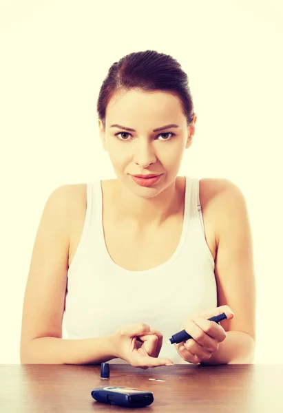 Woman taking sugar level test — Stock Photo, Image