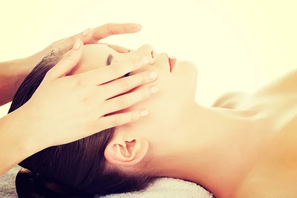 Relaxed woman enjoy receiving face massage — Stock Photo, Image