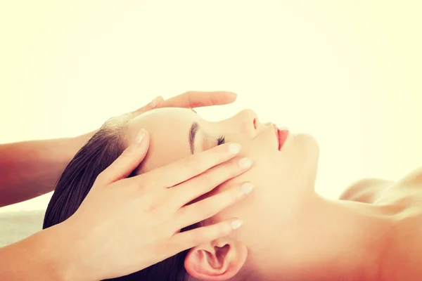 Relaxed woman enjoy receiving face massage — Stock Photo, Image