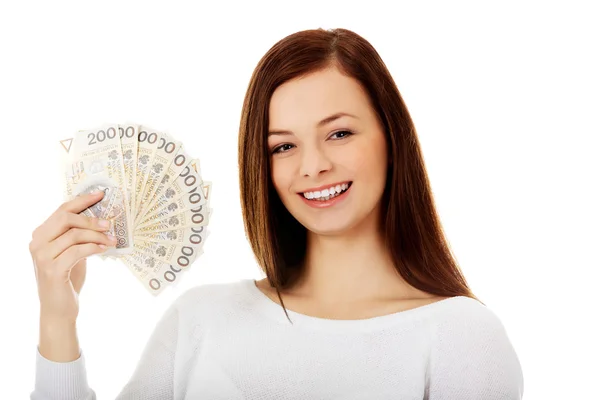 Happy young lady holding cash-polish zloty — Stock Photo, Image