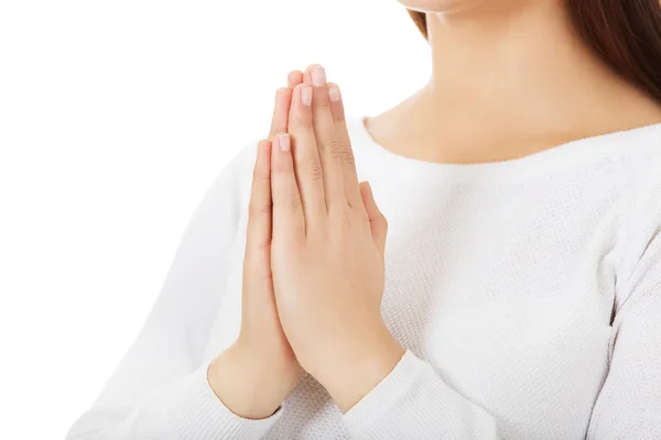 Beautiful young caucasian woman praying — Stock Photo, Image