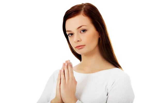 Mooie jonge Kaukasische vrouw bidden — Stockfoto